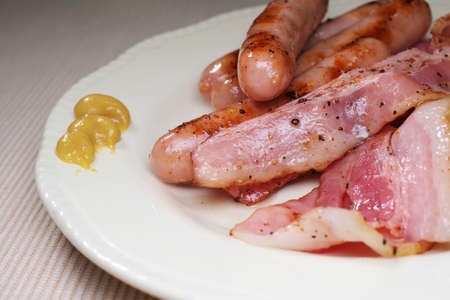Cooked bacon and sausageの写真素材