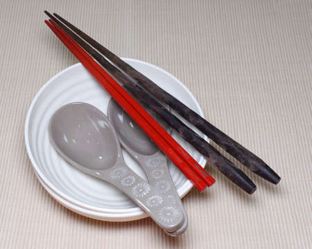 Chopsticks, Chinese spoon and small bowlの写真素材
