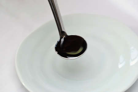 Weighing seasonings with a measuring spoonの写真素材
