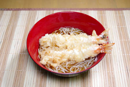 Soup soba noodle with shrimp tempuraの写真素材