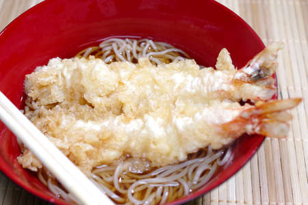 Soup soba noodle with shrimp tempuraの写真素材