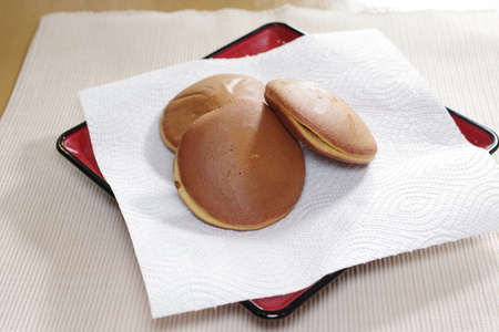 Sweets with red bean paste sandwiched between pancakes called Dorayakiの写真素材