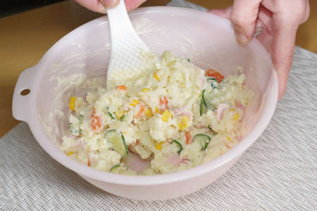 Cooking mashed potato saladの写真素材