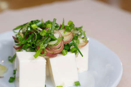 Hiyayakko with several kinds of condiment vegetablesの写真素材