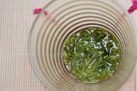 The root of wakame seaweed in the glassの写真素材