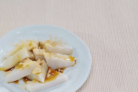 Kuzumochi sprinkled with black honey and soybean flourの写真素材