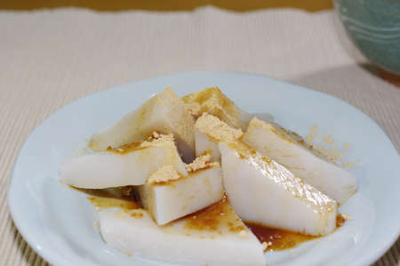 Kuzumochi sprinkled with black honey and soybean flourの写真素材