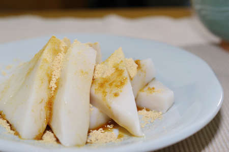 Kuzumochi sprinkled with black honey and soybean flourの写真素材