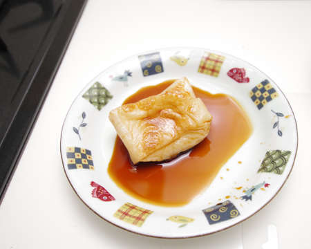 Soak the baked Rice cake in soy sauceの写真素材