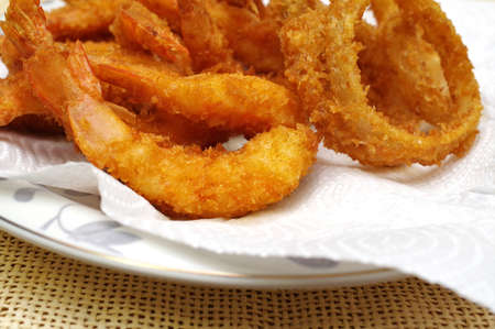 Fried Shrimp and Fried Onion Rings Platterの写真素材