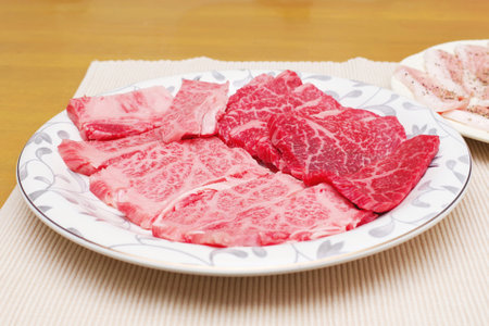 Assorted raw beef on a plateの写真素材