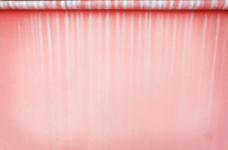 Water stain on pink wall backgroundの写真素材