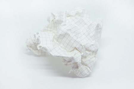 close up of a  crumpled grid paper on white backgroundの写真素材