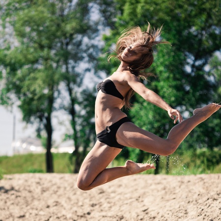 Young girl jumping and dancingの写真素材