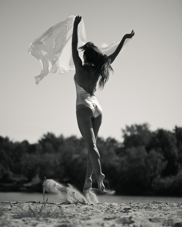 Young pretty girl dancing outdoorsの写真素材