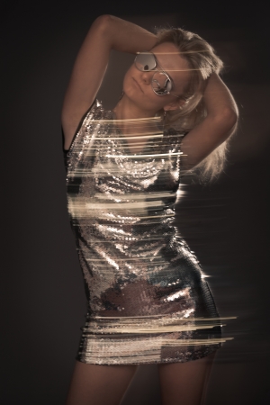 Dancing young girl portrait with blur motion effectの写真素材