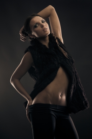 Portrait of gorgeous brunette wearing fur on naked bodyの写真素材