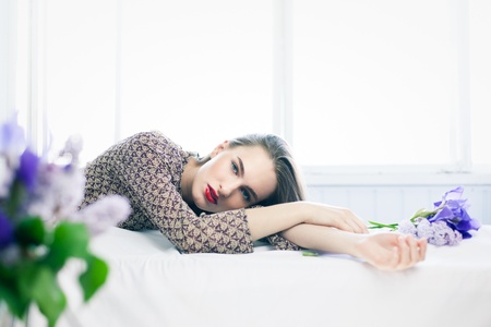 Sensual fashion portrait of young girl with bouquet of flowersの写真素材