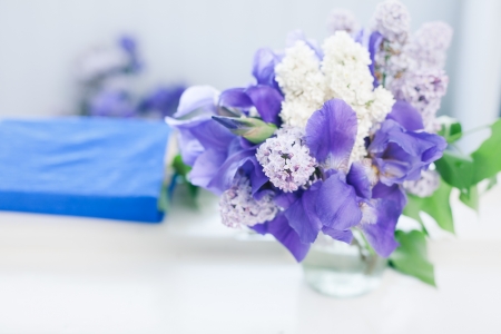 Simple still life - book and bouquet on windowの写真素材