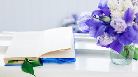 Simple still life - book and bouquet on window