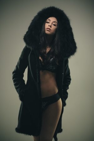 Fashion portrait of young sensual brunette girl in furの写真素材
