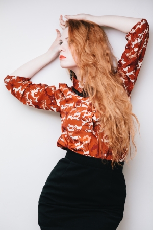 Sensual fashion portrait of redhead vamp girl with long hairの写真素材