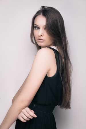 Sensual fashion portrait of young brunette girl with long hairの写真素材