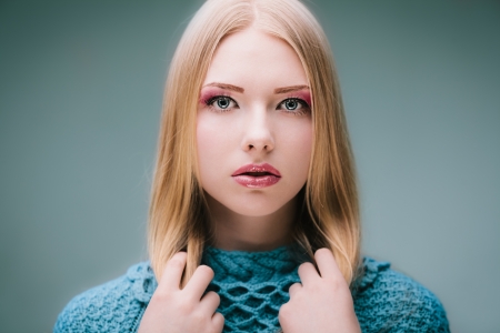 Fashion portrait of gorgeous young blond in studioの写真素材