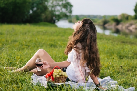 Young brunette woman enjoying picnicの写真素材