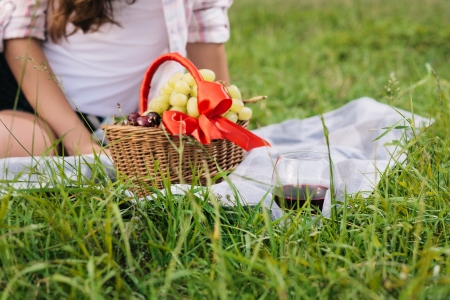 Enjoying picnic outdoors with healthy foodの写真素材