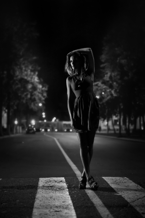 Art fashion portrait of young woman on crosswalk. Black and whiteの写真素材