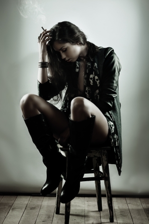 Fashion artistic portrait of brunette girl in grunge styleの写真素材