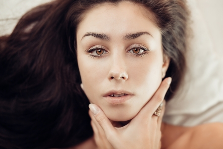 Sensual artistic portrait of gorgeous young brunette womanの写真素材