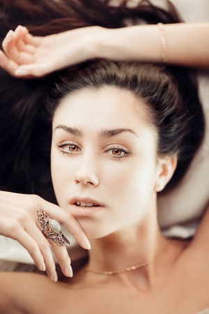 Sensual artistic portrait of gorgeous young brunette womanの写真素材