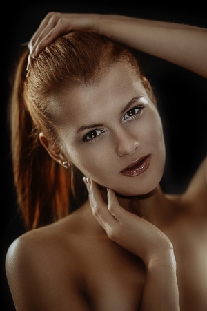 Fashion portrait of young gorgeous redhead womanの写真素材