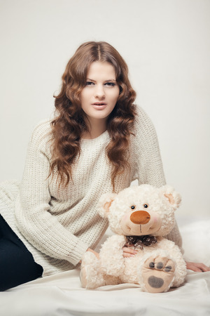 Portrait of pretty girl with teddy bearの写真素材