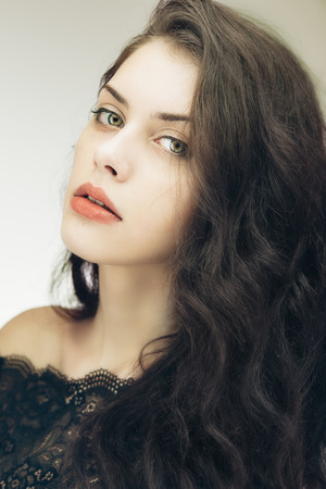 Art studio portrait of young gorgeous brunette girlの写真素材