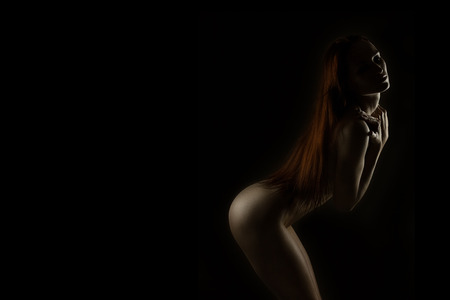 Art nude female portrait on black. Lot of copy spaceの写真素材