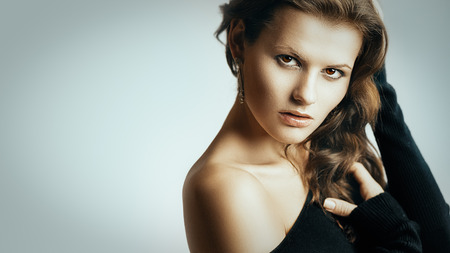 Artistic portrait of young beautiful brunette womanの写真素材