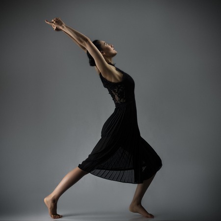 Young woman in artistic yoga like pose. Black and whiteの写真素材