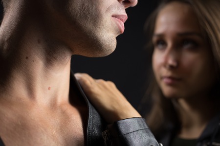 Close up to part of face of man with woman on background. Shallow depth of fieldの写真素材