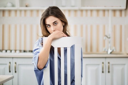 Young woman in chairの写真素材