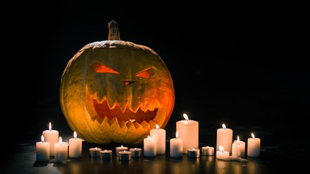 Helloween pumpkin with candlesの写真素材