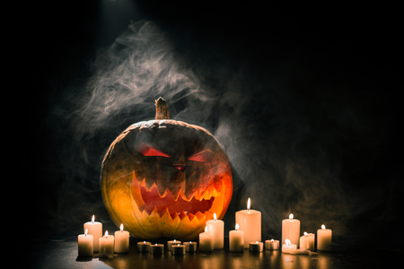 Helloween pumpkin with candlesの写真素材