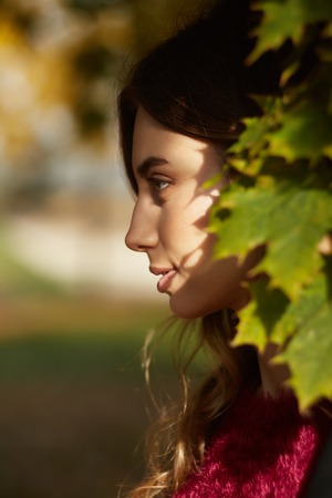 Woman in autumn parkの写真素材