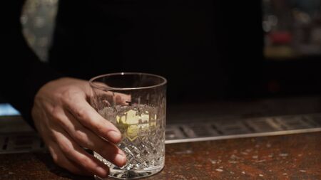 Hand of bartender with a cocktailsの写真素材