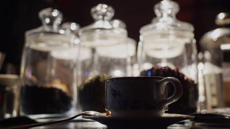 Silhouette of cup of tea on background with tea glass bulbsの写真素材
