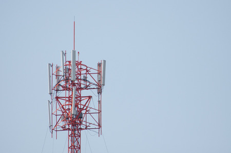 Telecommunication Tower. Cell Phone Signal Tower on sky background