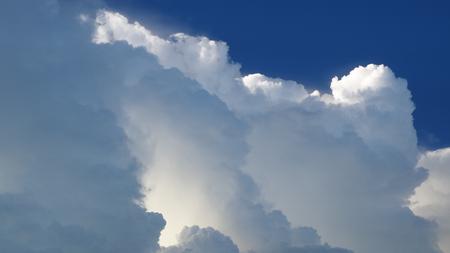 Blue sky background with cloudsの写真素材