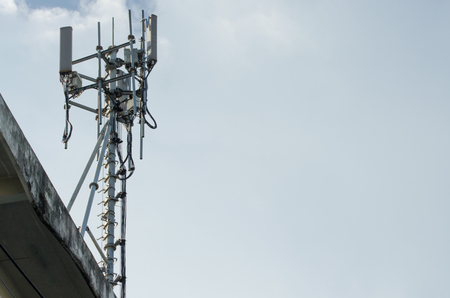 Telecommunication Tower. Cell Phone Signal Tower on sky background Can be used for display or montage your production. Presentation of advertising ideas.の写真素材